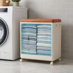 Aufbewahrungsbox für Kleidung mit Deckel und Rollen 122 L rollbarer Wäschekorb Orange